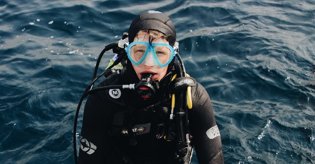 man wearing scuba diving suit